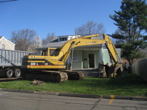 Wrecking equipment tears into Gustave Whitehead's historic home, morning of April 28th.